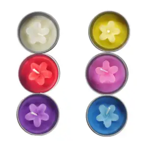 1pza Vela de cera con aroma y adorno de flor + frasco metálico con ta…