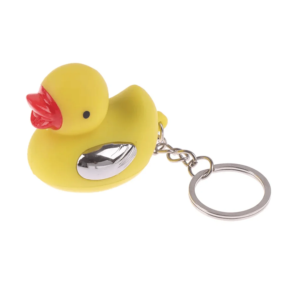 1pza Llavero de patito con argolla de metal, luz led y toques / cd-014