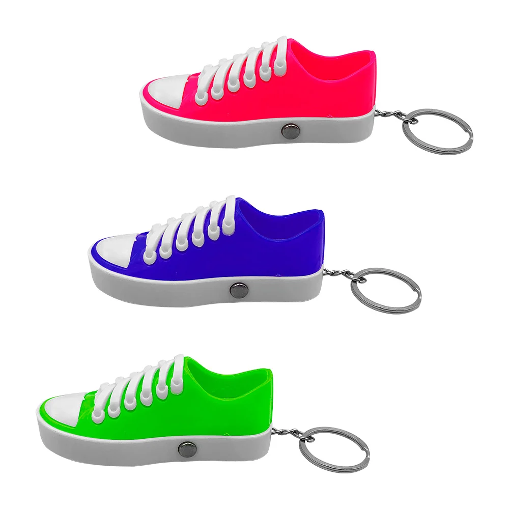 1pza Llavero en forma de tenis plástico bicolor con lámpara pequeña, láser y toques de broma, variedad de colores / y-d483