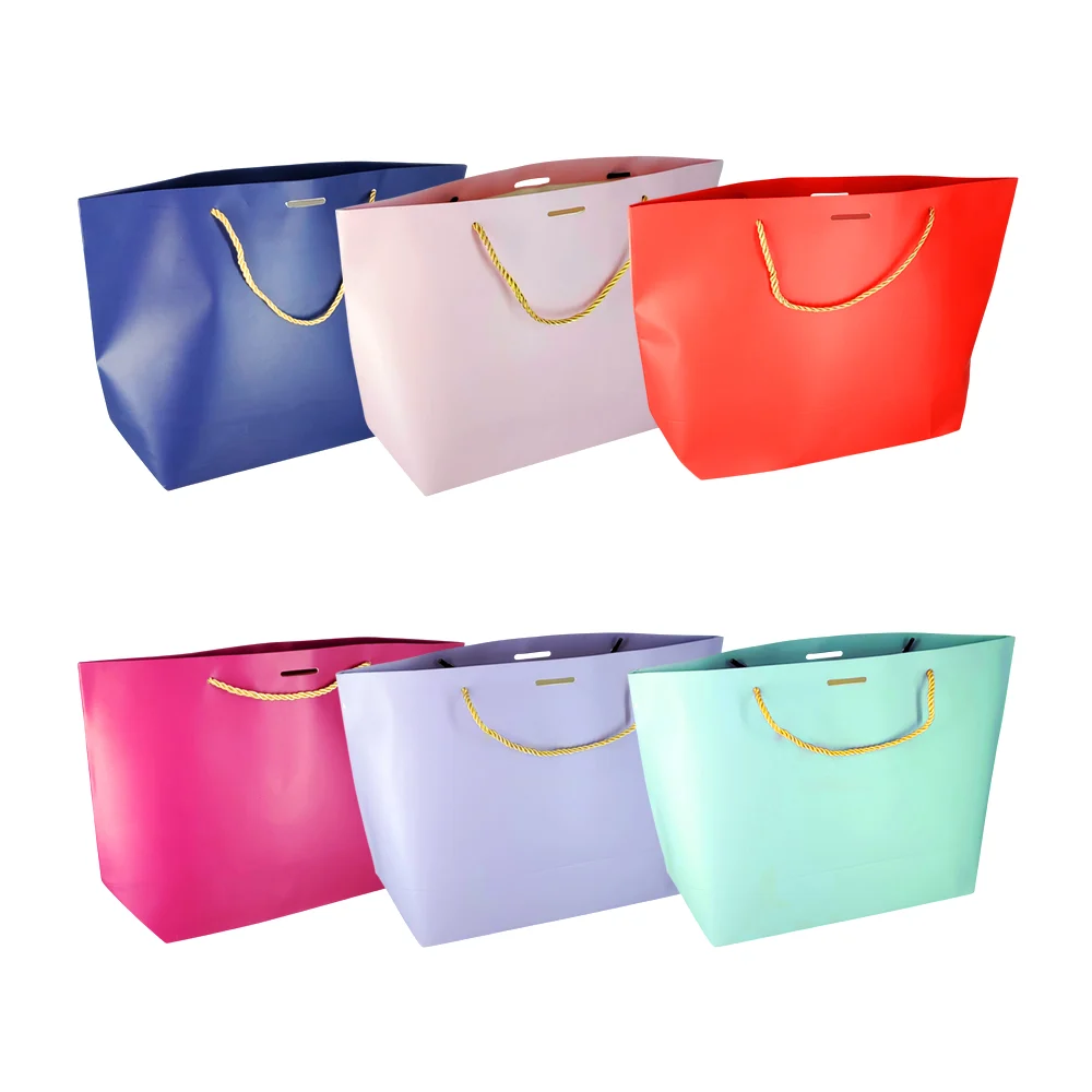 Bolsa de regalo mediana, papel cartón con diseño liso y asa tipo cuerda 37x19.5x11cm, variedad de colores