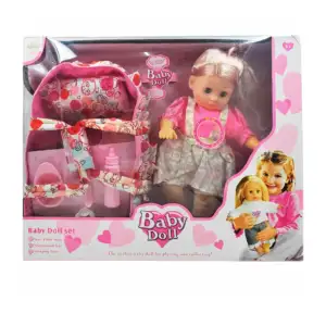 Muñeca tipo nenuco con sonido + cuna de tela, chupón, cubiertos, plat…