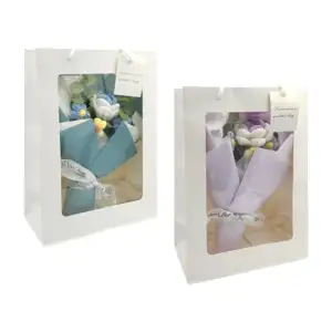 Bolsa de regalo con tira de luz led y ramo de 4 flores tejidas, varie…