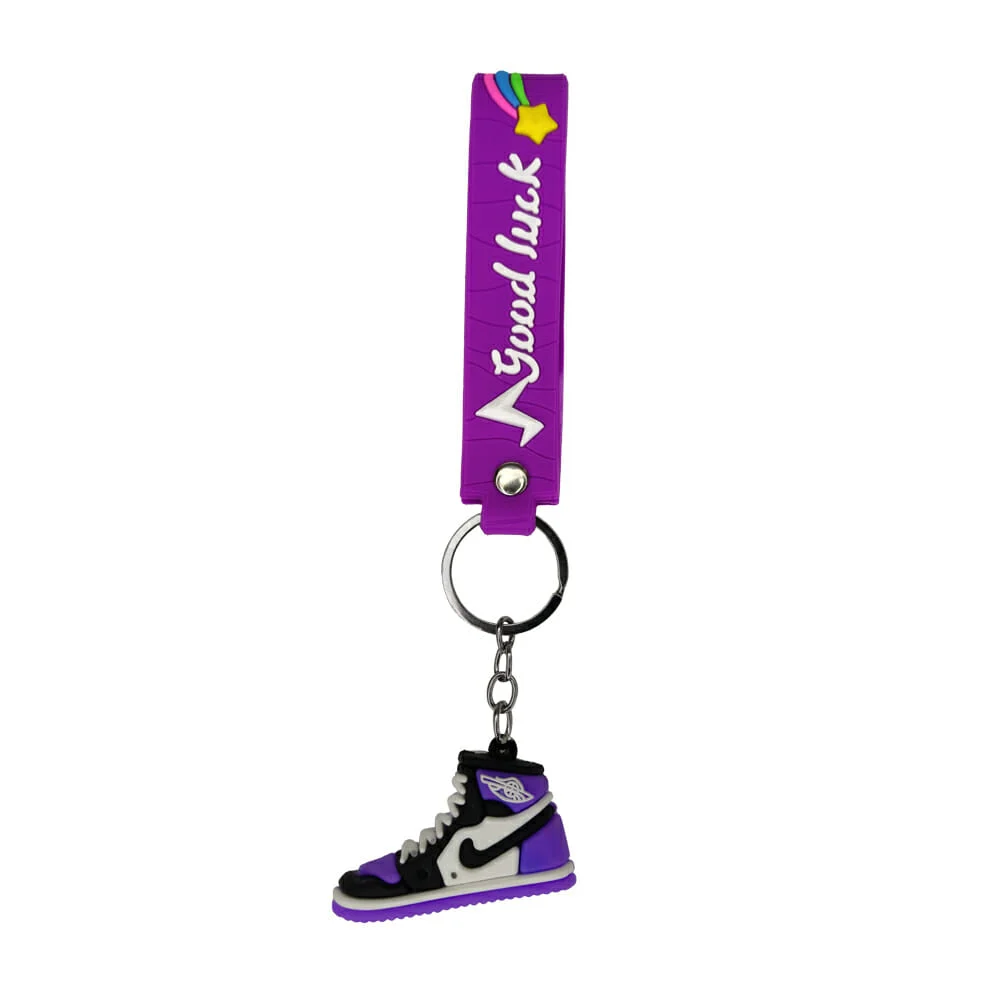 1pza de llavero mediano con diseño de tenis + banda con frase, variedad de colores