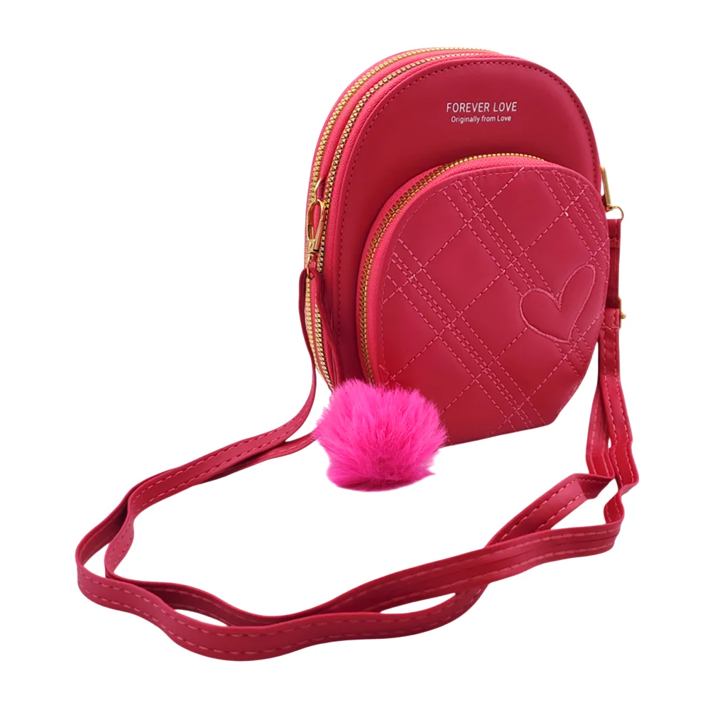 Bolsa de mano ovalada con 3 compartimentos, costura de rombos y corazón + pompon