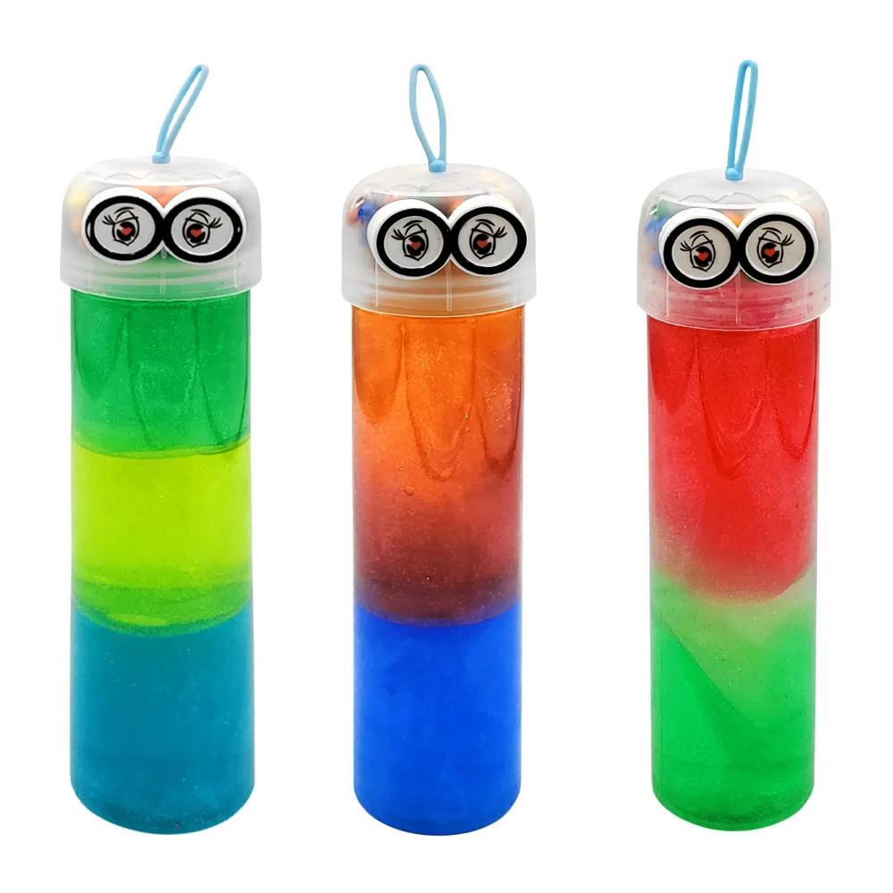 Bote cilíndrico con slime brilloso tricolor + tapa con bolitas y ojos de corazón