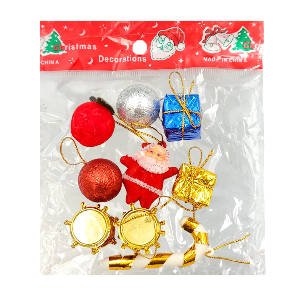 Blíster con 9 adornos navideños, regalos, tambores, esferas, bastón y santa