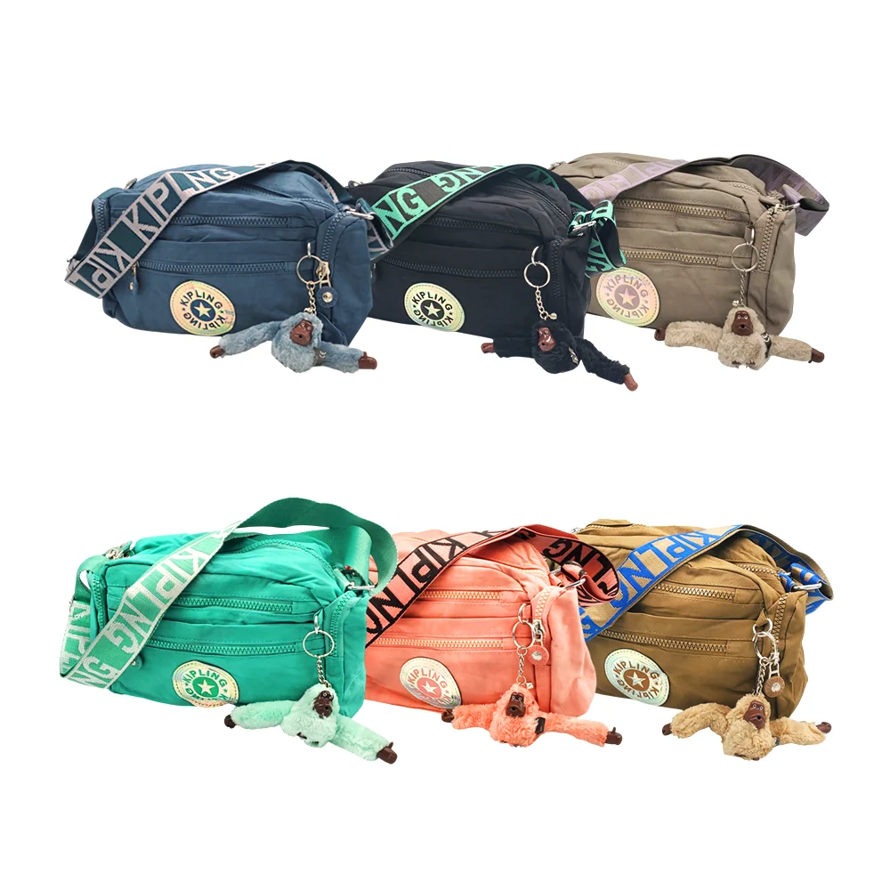 Bolsa kipling con 6 compartimentos, asa estampada + llavero de mono, variedad