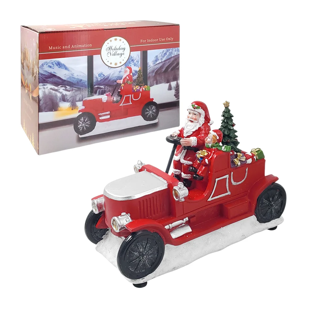 Carro navideño con santa claus y acompa...