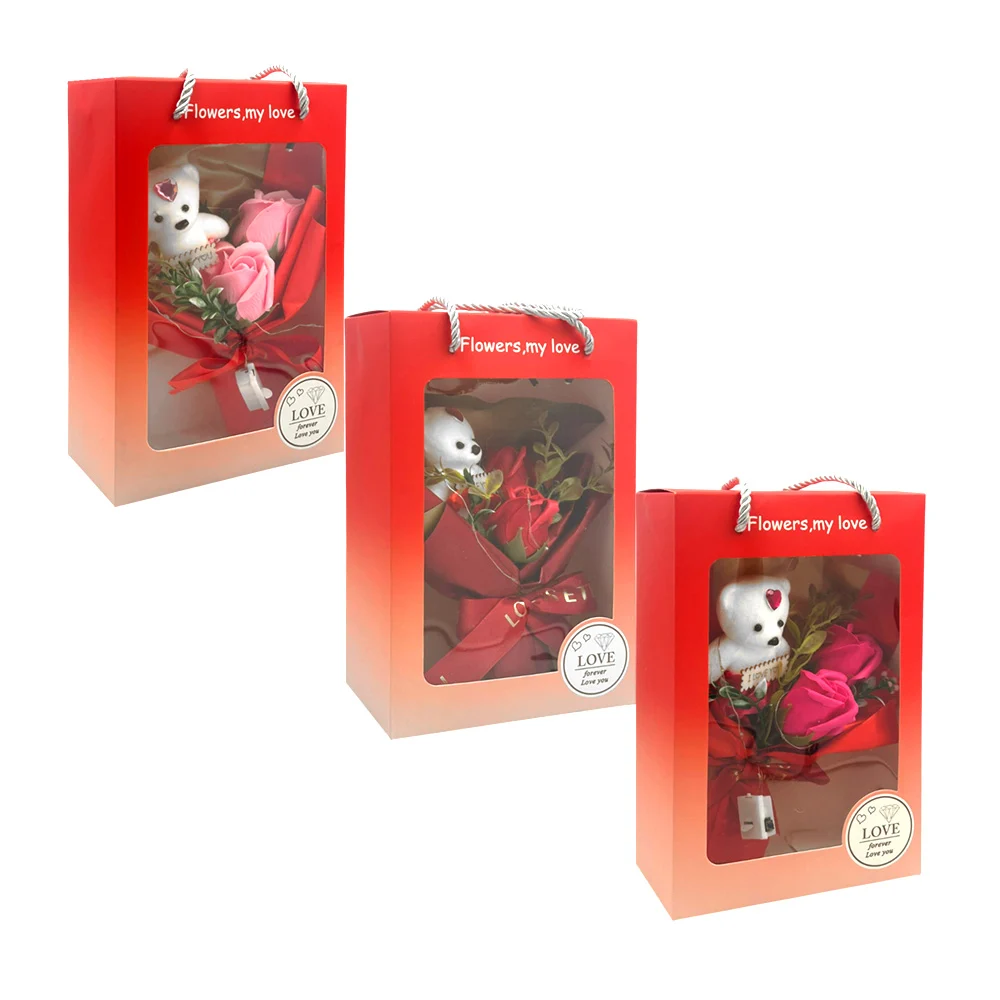 Caja con ramo decorativo, mini oso de terciopelo, 2 rosas artificiales y luz led